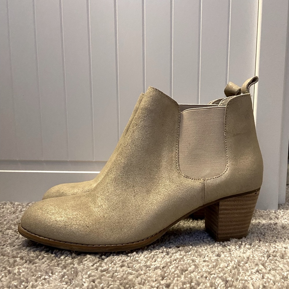 Shiny gold and white heeled booties